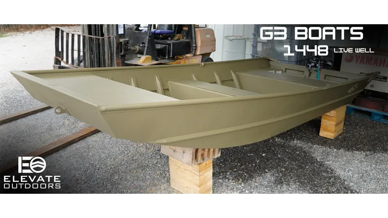 The Image of 2025 G3 Gator Tough 1448 LW boat displayed on wooden blocks. - 0