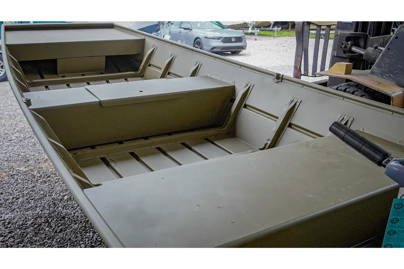 Slide: The Image of 2025 G3 Gator Tough 1448 LW boat interior, showcasing seating and storage areas. - 11