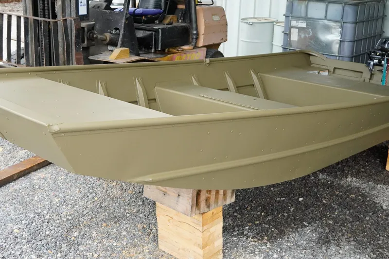 Slide: The Image of 2025 G3 Gator Tough 1448 LW boat on wooden blocks, outdoor setting. - 17