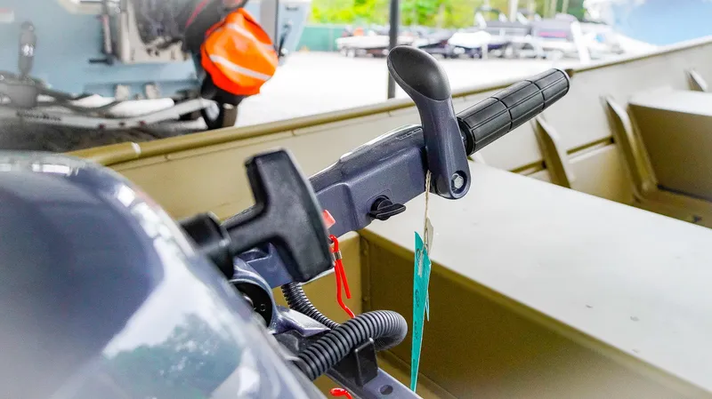 Slide: The Image of Close-up of 2025 G3 Gator Tough 1448 LW boat throttle handle. - 4