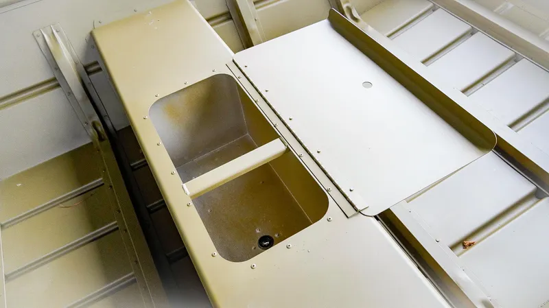 Slide: The Image of 2025 G3 Gator Tough 1448 LW boat interior with storage compartment. - 5
