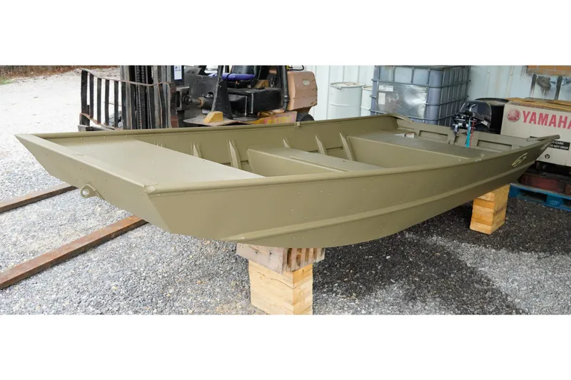 Slide: The Image of 2025 G3 Gator Tough 1448 LW boat on wooden blocks in a storage area. - 9