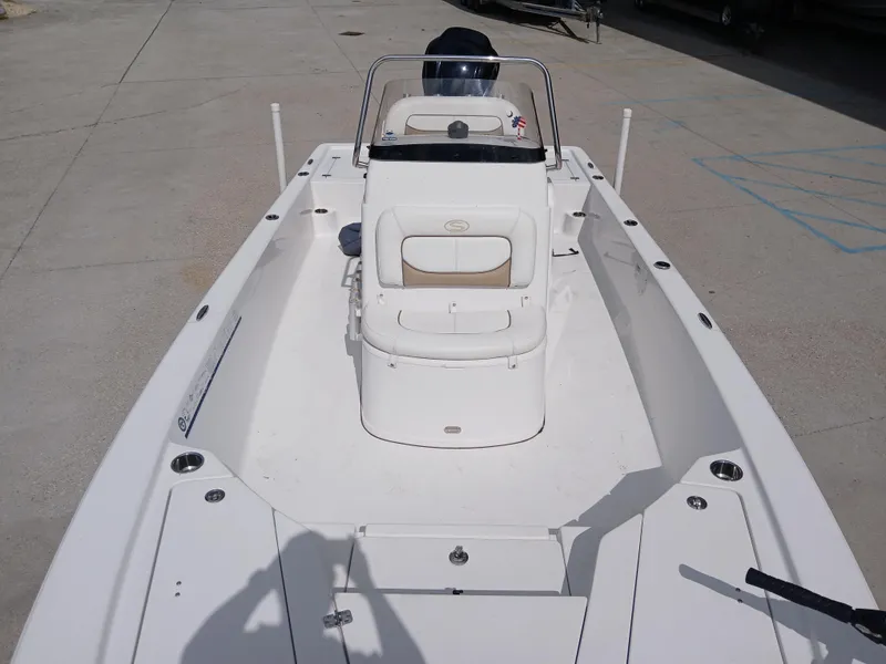 Slide: The Image of 2015 Sportsman Tournament 234 Bay Boat, white deck, center console, parked on concrete surface. - 13