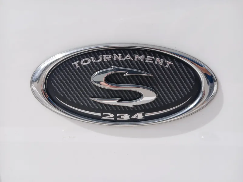 Slide: The Image of Emblem of 2015 Sportsman Tournament 234 Bay Boat on carbon fiber background. - 14