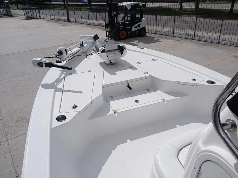Slide: The Image of 2015 Sportsman Tournament 234 Bay Boat deck with seating and storage compartments. - 15
