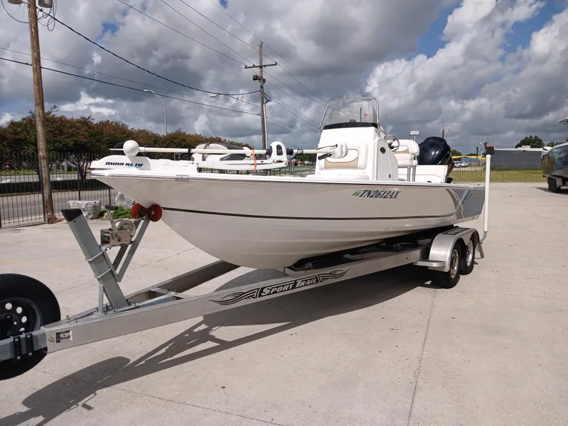 Slide: The Image of 2015 Sportsman Tournament 234 Bay Boat on trailer under cloudy sky. - 18