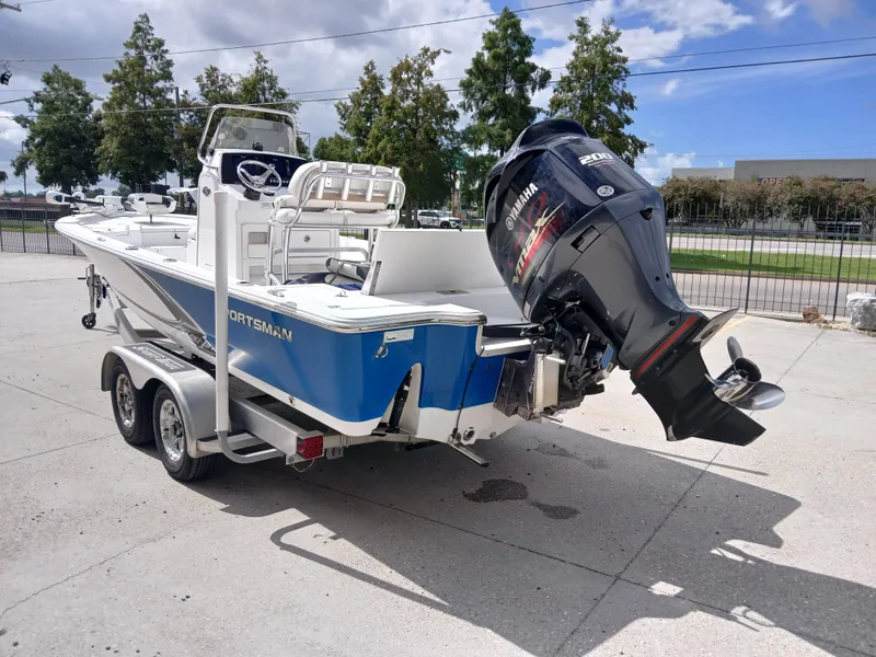 Slide: The Image of 2015 Sportsman Tournament 234 Bay Boat with Yamaha outboard motor on trailer. - 19
