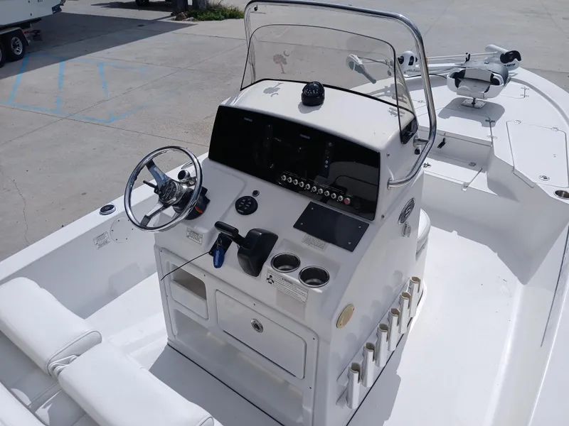 Slide: The Image of 2015 Sportsman Tournament 234 Bay Boat cockpit with steering wheel and control panel. - 8