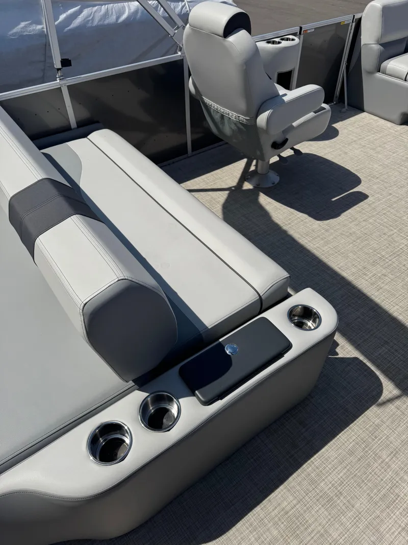 Slide: The Image of Luxurious seating on 2025 SunCatcher Select 324SL pontoon boat with cup holders and armrests. - 3