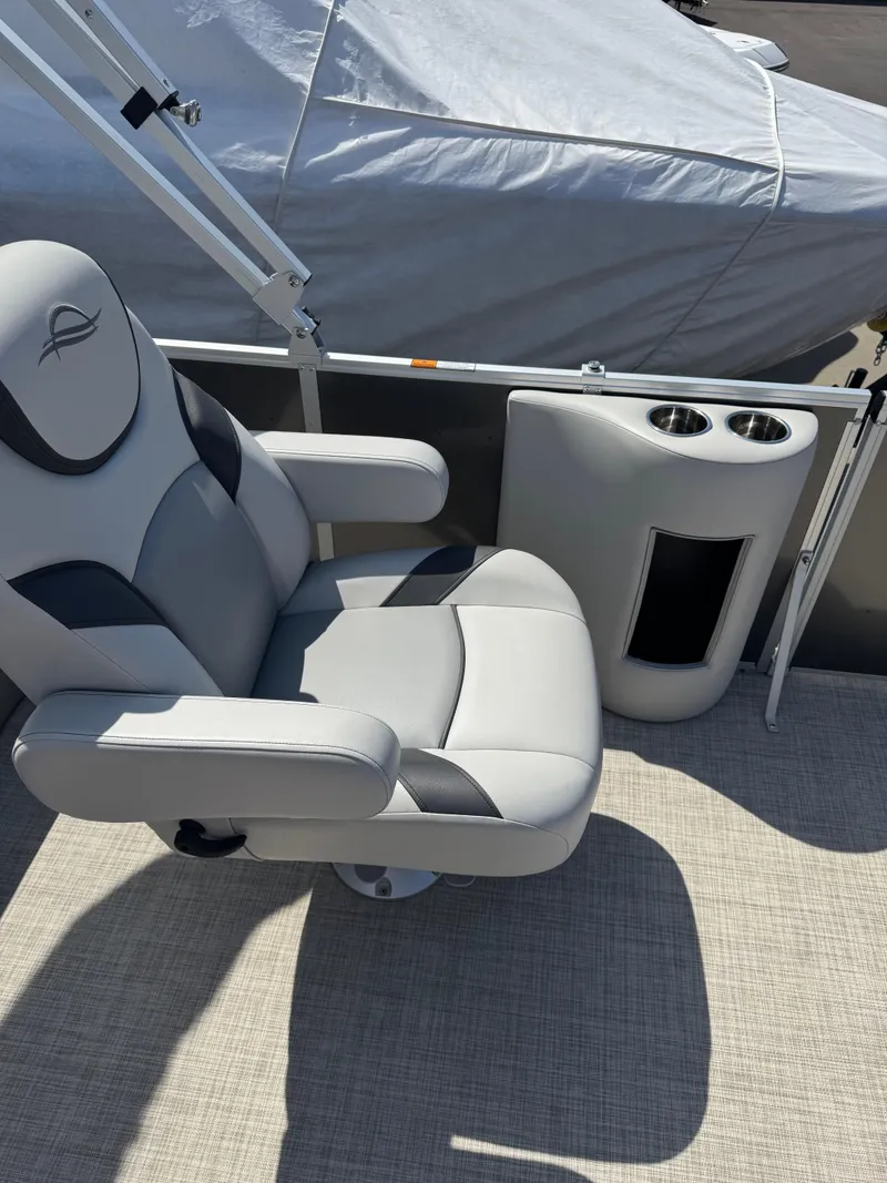 Slide: The Image of Luxurious seating on 2025 SunCatcher Select 324SL boat with cup holders. - 5