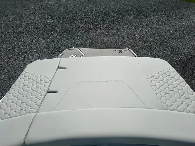 Slide: The Image of 2026 Four Winns H4 Freedom boat with sleek white upholstery and hexagonal patterns. - 12