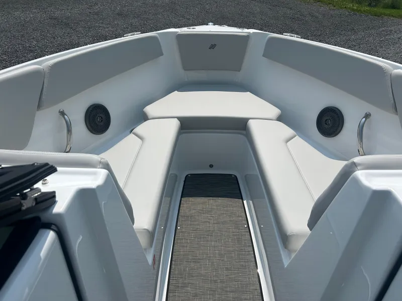 Slide: The Image of 2026 Four Winns H4 Freedom boat interior with cushioned seating and speakers. - 17