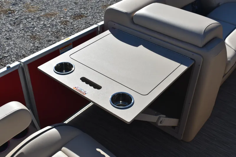 Slide: The Image of Godfrey Sweetwater 2086 SB 2025 boat interior with foldable table and cup holders. - 13