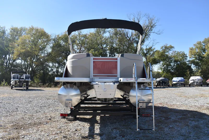 Slide: The Image of 2025 Godfrey Sweetwater 2086 SB pontoon boat on trailer, parked outdoors. - 3