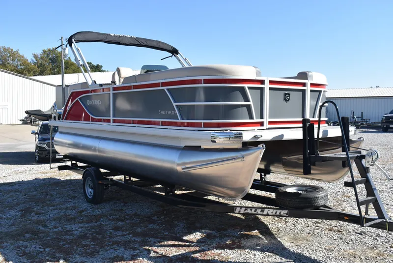 Slide: The Image of 2025 Godfrey Sweetwater 2086 SB pontoon boat on trailer, parked outdoors. - 5