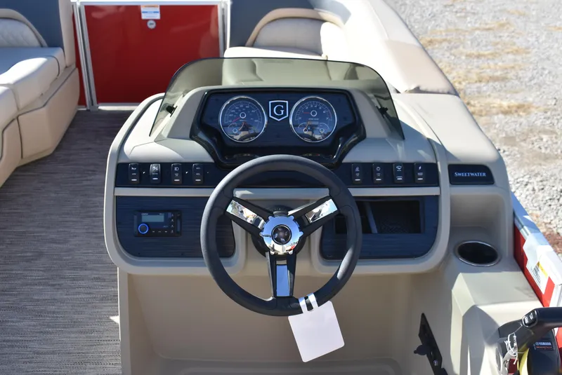 Slide: The Image of 2025 Godfrey Sweetwater 2086 SB boat dashboard with steering wheel and controls. - 9