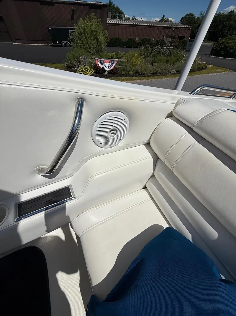 Slide: The Image of Interior of 2002 Fountain 29 Fever boat with white seating and speaker. - 11
