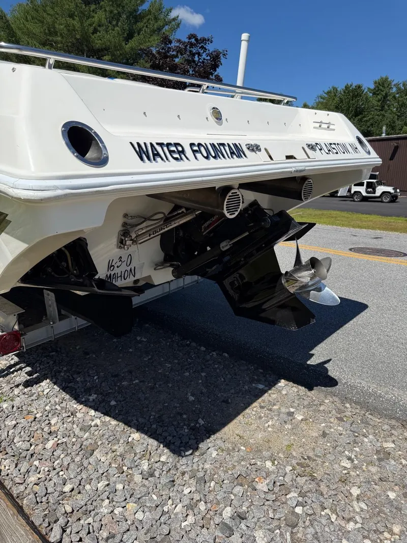 Slide: The Image of 2002 Fountain 29 Fever boat rear view with dual propellers on a sunny day. - 16