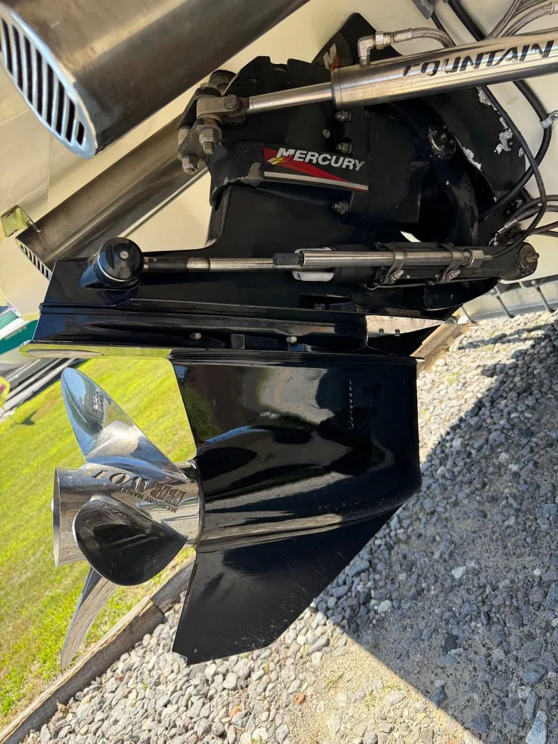 Slide: The Image of Close-up of a 2002 Fountain 29 Fever boat's Mercury outdrive and propeller. - 18