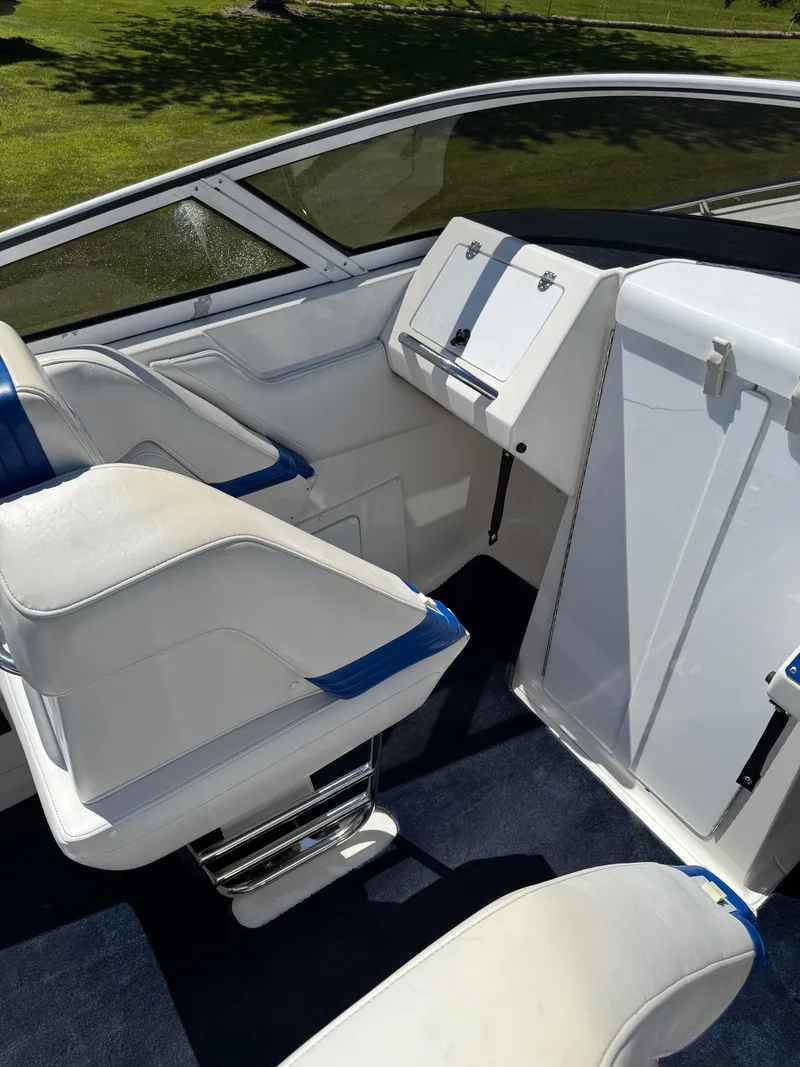Slide: The Image of Interior of 2002 Fountain 29 Fever boat with white and blue seating. - 8