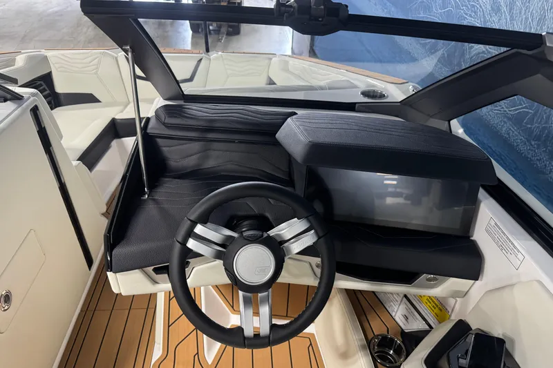 Slide: The Image of 2026 Nautique Super Air Nautique G21 cockpit with sleek steering wheel and modern dashboard design. - 12