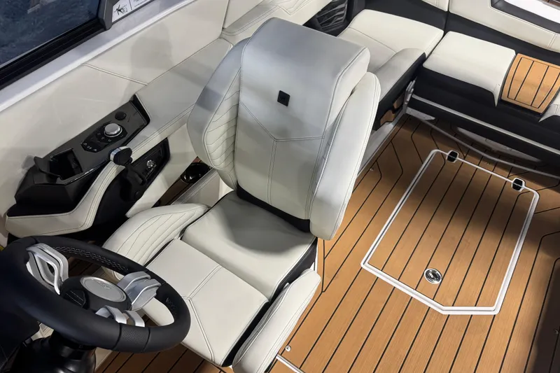 Slide: The Image of 2026 Nautique Super Air Nautique G21 interior with luxurious seating and modern controls. - 13