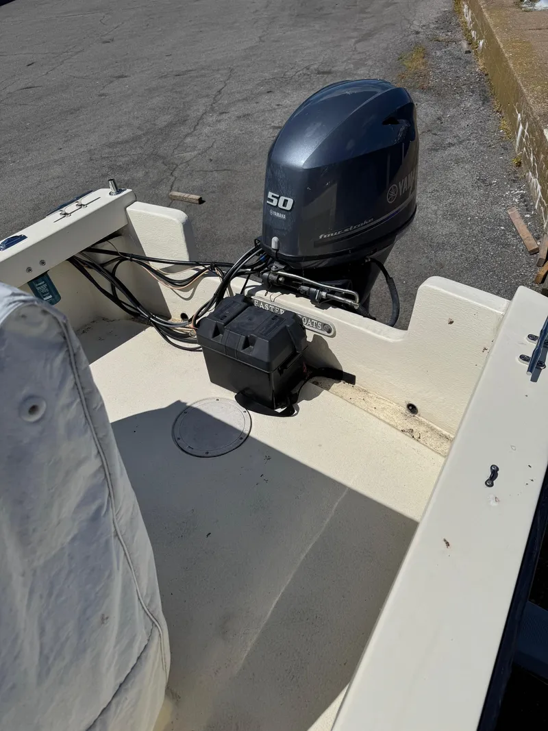 Slide: The Image of 2014 Eastern 19 boat with Yamaha 50 outboard motor on a concrete surface. - 10