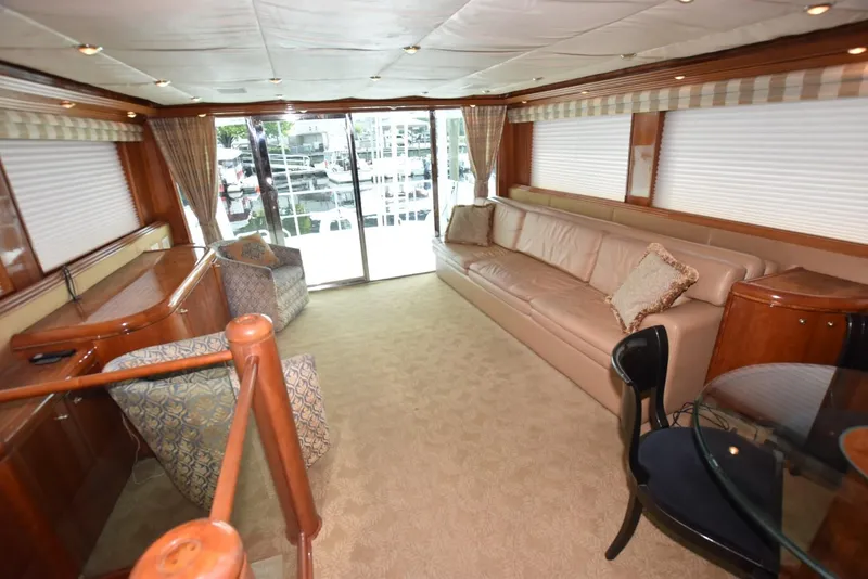 Slide: The Image of Luxurious interior of 1998 Hatteras 74 Sport Deck yacht with elegant seating and decor. - 18