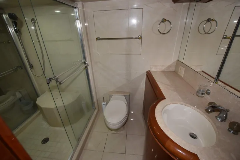 Slide: The Image of Bathroom interior of 1998 Hatteras 74 Sport Deck yacht with shower and sink. - 19