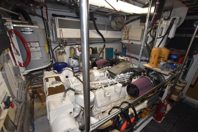 Slide: The Image of Engine room of 1998 Hatteras 74 Sport Deck yacht, featuring machinery and equipment. - 37