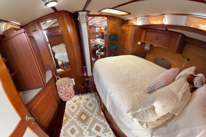 Slide: The Image of Cozy 1994 Catalina Morgan yacht cabin with wooden interior and comfortable bedding. - 28
