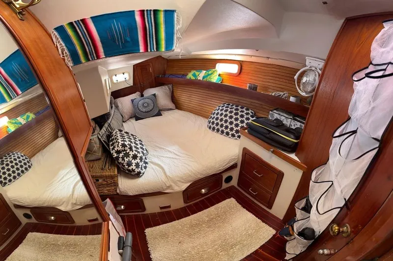 Slide: The Image of Cozy cabin interior of a 1994 Catalina Morgan boat with colorful decor and wooden accents. - 31