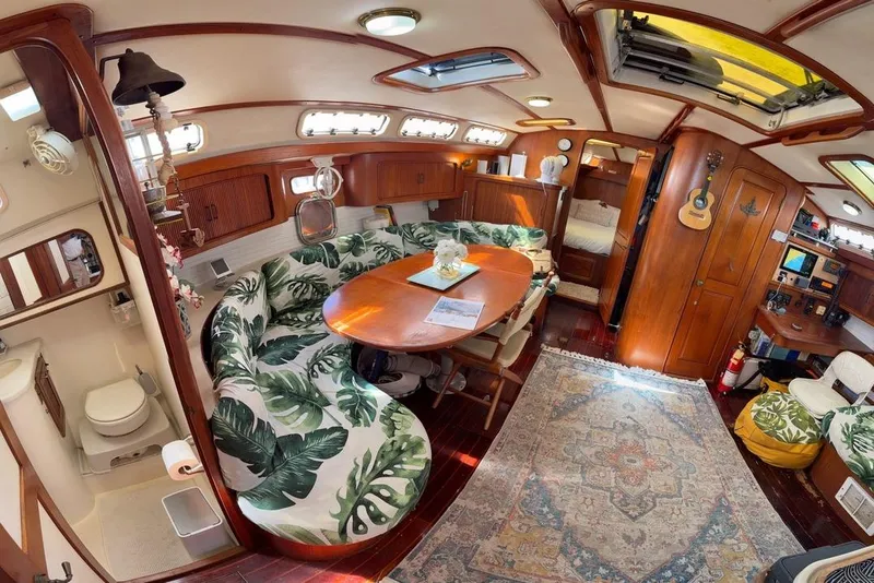 Slide: The Image of Luxurious 1994 Catalina Morgan yacht interior with tropical decor and cozy seating area. - 32