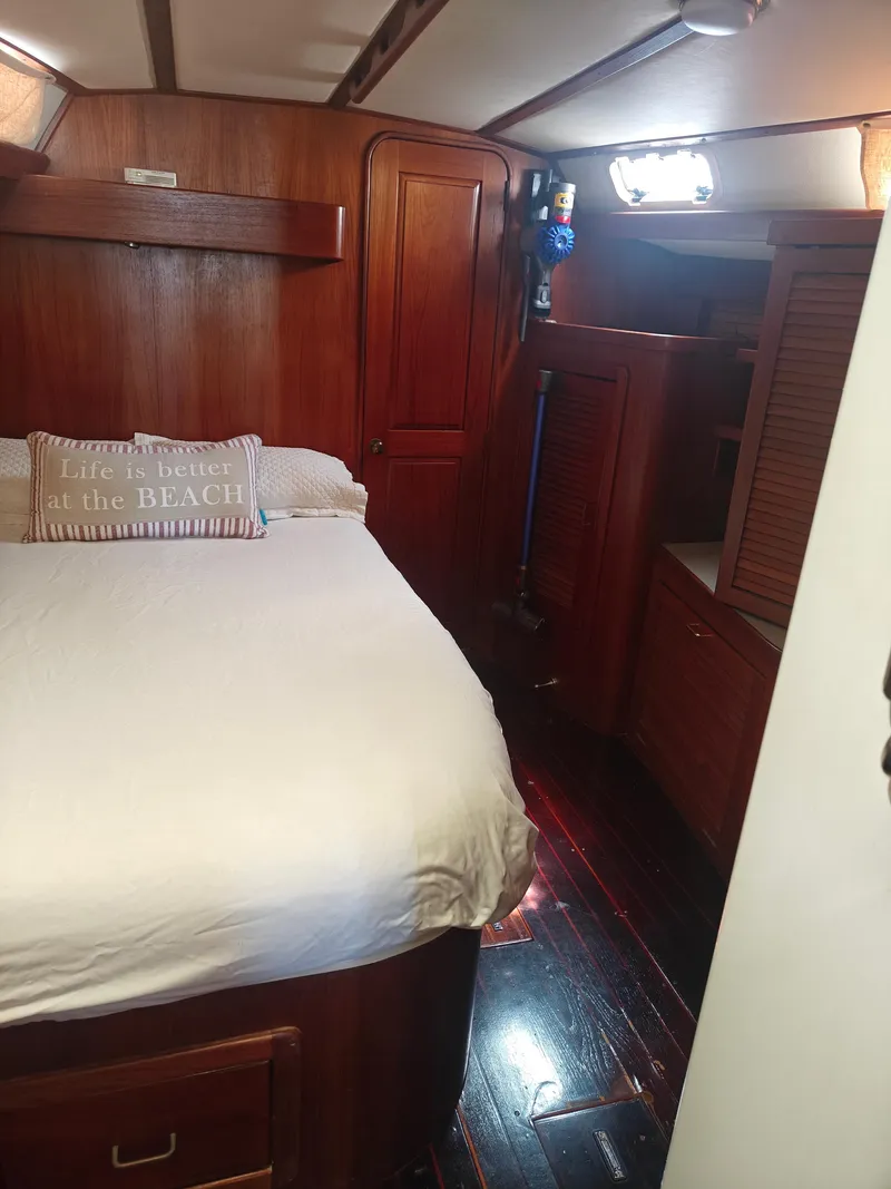 Slide: The Image of Cozy 1994 Catalina Morgan yacht cabin with wooden interior and comfortable bed. - 5