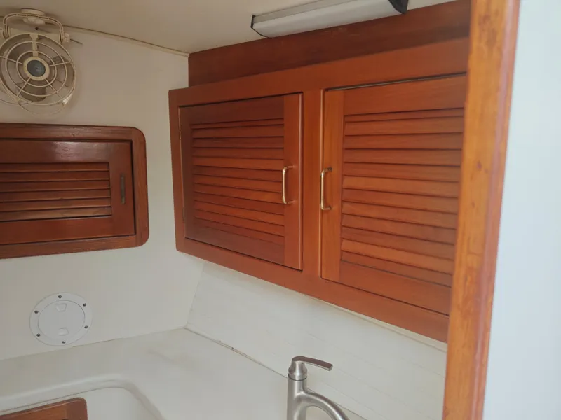 Slide: The Image of Wooden cabinets and sink in 1994 Catalina Morgan boat interior. - 7