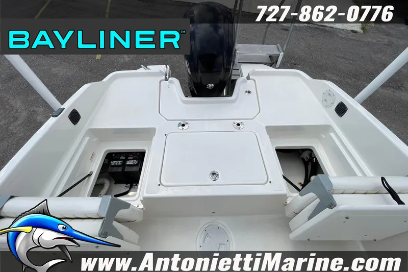 Slide: The Image of 2020 Bayliner Element F21 boat deck with storage compartments and branding. - 10