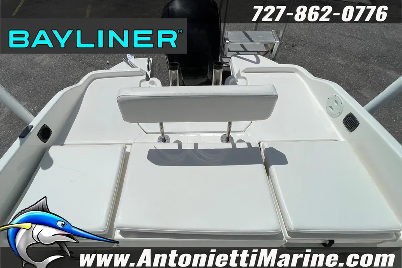Slide: The Image of 2020 Bayliner Element F21 boat deck with seating, contact details, and logo. - 20