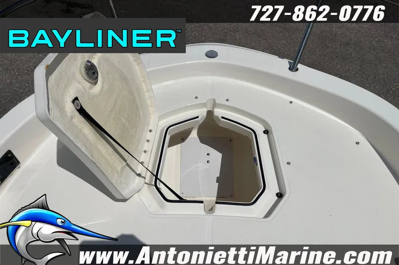 Slide: The Image of 2020 Bayliner Element F21 boat storage compartment open, showcasing interior space. - 30