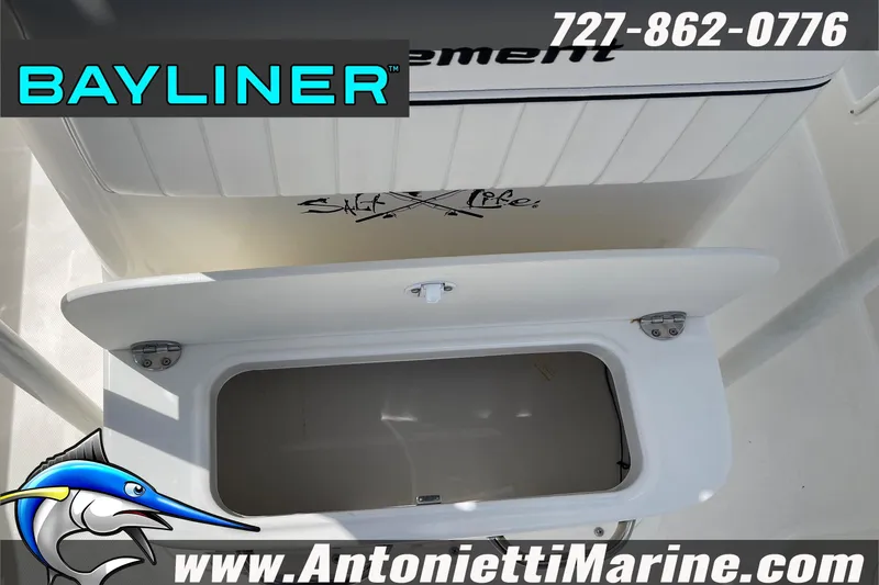 Slide: The Image of 2020 Bayliner Element F21 boat storage compartment with logo and contact details. - 7
