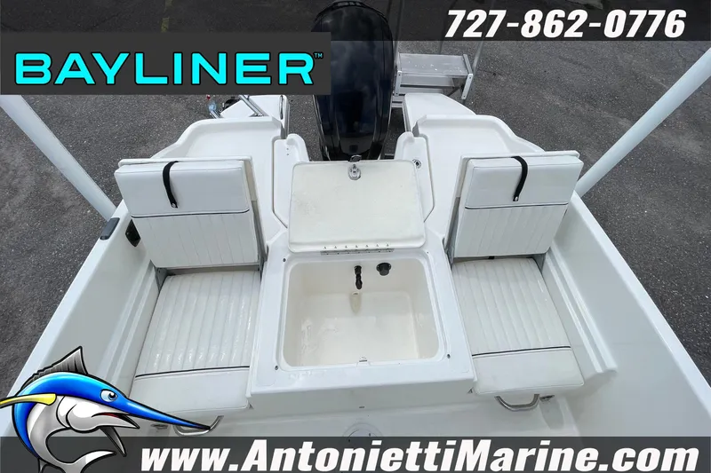 Slide: The Image of 2020 Bayliner Element F21 boat interior with seating and storage, Antonietti Marine branding. - 9