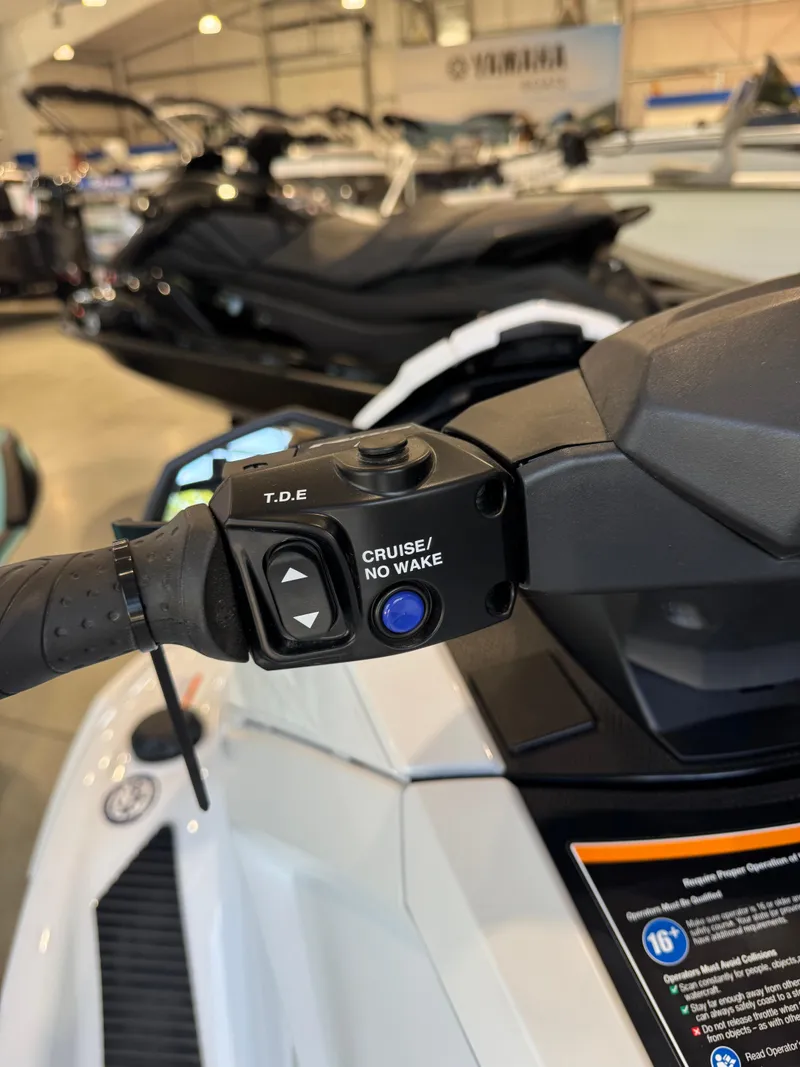 Slide: The Image of 2025 Yamaha WaveRunner VX Cruiser handlebar controls in showroom setting. - 10