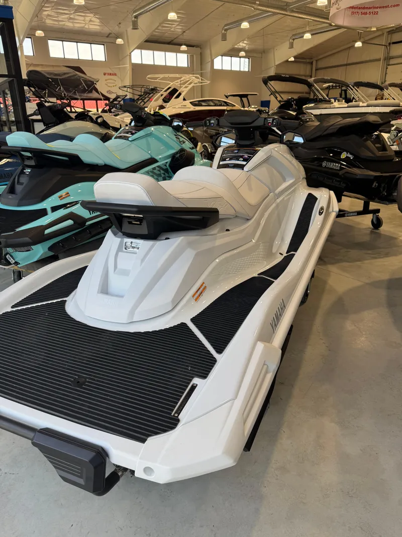 Slide: The Image of 2025 Yamaha WaveRunner VX Cruiser in showroom, surrounded by other personal watercraft. - 3