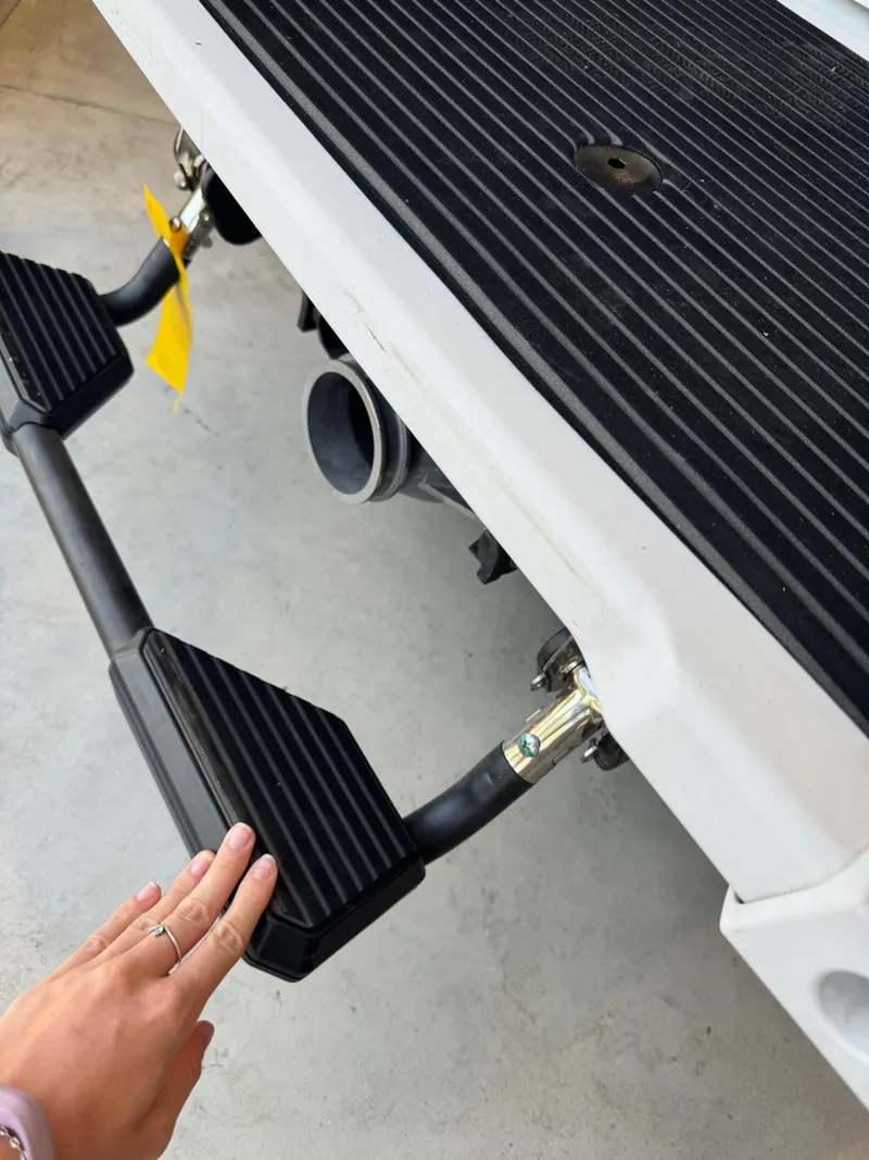 Slide: The Image of 2025 Yamaha WaveRunner VX Cruiser rear step detail with hand for scale. - 4