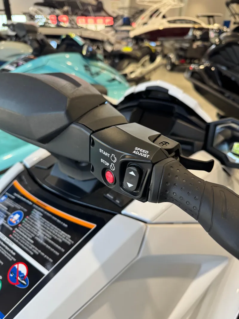 Slide: The Image of 2025 Yamaha WaveRunner VX Cruiser handlebar controls in a showroom setting. - 9