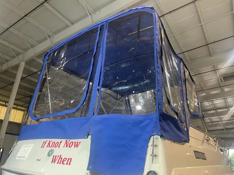 Slide: The Image of 1993 Regal Ambassador 233 boat with blue canopy and humorous text, "If Knot Now... When." - 15