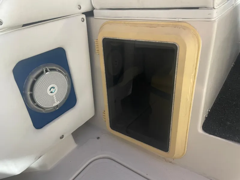 Slide: The Image of Interior of 1993 Regal Ambassador 233 boat with speaker and storage compartment. - 20