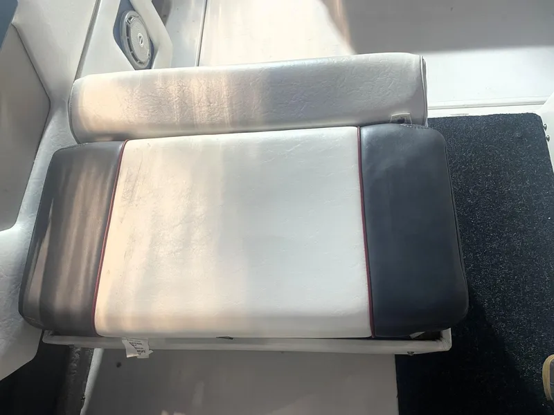 Slide: The Image of 1993 Regal Ambassador 233 boat seat with white and black upholstery. - 21
