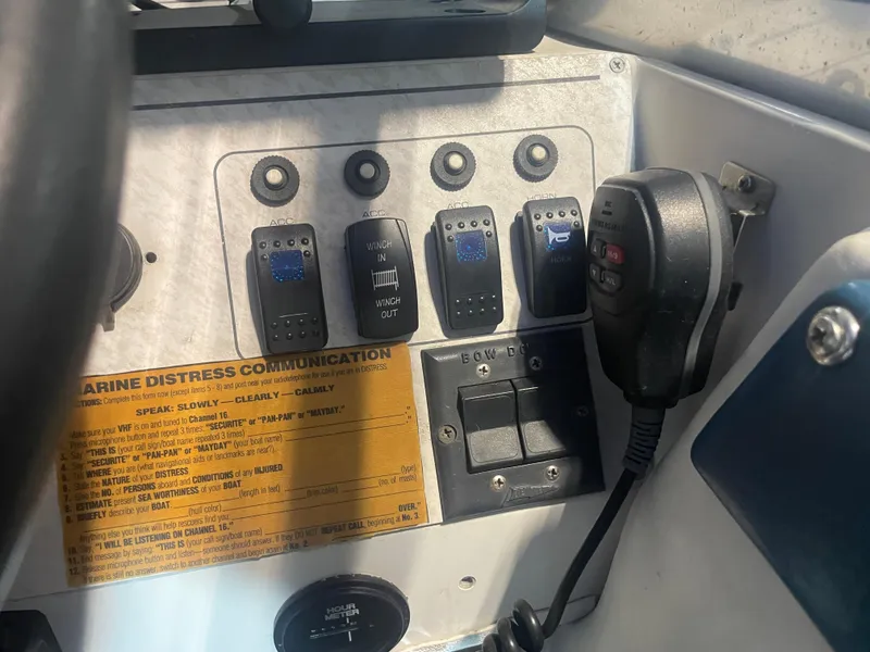 Slide: The Image of Control panel of a 1993 Regal Ambassador 233 boat with marine communication equipment. - 25