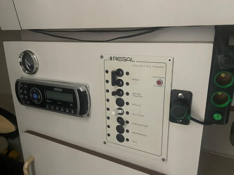 Slide: The Image of 1993 Regal Ambassador 233 control panel with stereo and power switches. - 37