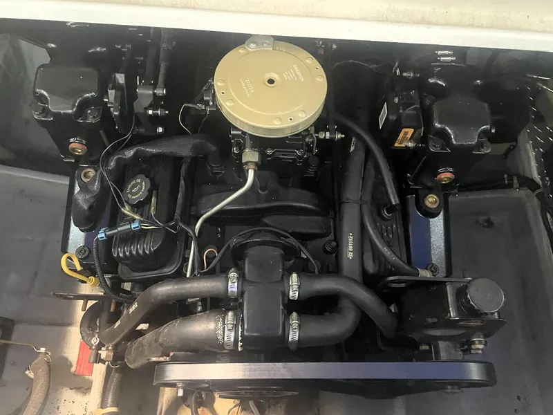 Slide: The Image of 1993 Regal Ambassador 233 engine compartment, showcasing mechanical components and wiring. - 38